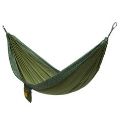 a green hammock hanging in the air