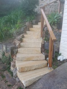 a set of stone steps leading up to a house