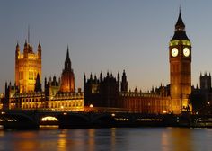 the big ben clock tower towering over the city of london, england at night time