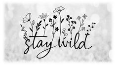 the word stay wild written in black ink on a white background with flowers and leaves