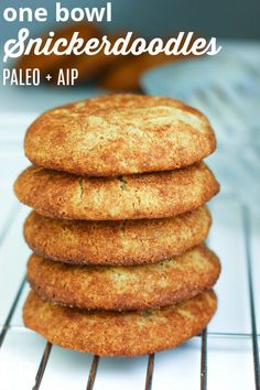 a stack of cookies sitting on top of a cooling rack with the words, one bowl snickkerdoodleles pale and air