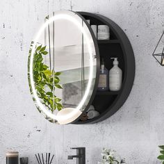 a round mirror mounted to the side of a wall