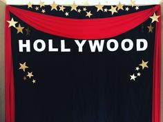 the hollywood sign is decorated with gold stars and red draping on it's sides