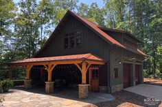 a large garage in the middle of a wooded area