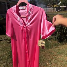 Brand New With Tags. Never Worn! Very Feminine Pink Satin, Dress Length Robe With Short Sleeves. Embroidered Floral Rose Pattern Along V-Neck Line. Button Up Front With Faux Tie At Top Which Actually Snaps. Even Has A Pocket On The Right Hand Side! "100% Anton Satin Nylon Exclusive Of Trim". Part Of The "Collectibles" Line By Jc Penney "A Concept Of Fashion For The Exquisite And Feminine Touch Found In Our Loungewear Coordinates Group. They Are Meant To Be Collected Individually And Worn A Varie Fitted Feminine Nightwear Dress, Feminine Fitted Dress For Pajama Party, Fitted Short Sleeve Nightgown For Spring, Pink Satin Dress, Sheer Robe, Jcpenney Dresses, Nightgown Sets, Vintage Nightgown, Floral Robes