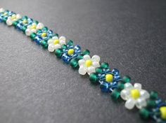 the beaded bracelet has flowers on it