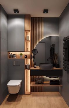 a modern bathroom with wood paneling on the walls and wooden shelves in front of the toilet