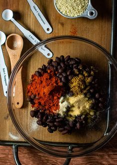 the ingredients to make this recipe include beans, spices and seasonings in a glass bowl