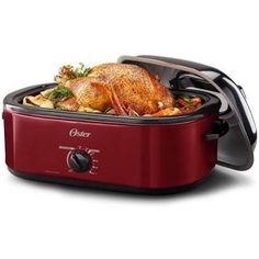 an image of a red slow cooker with food in it's lid on white background