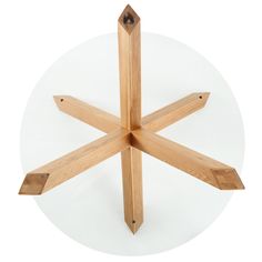 four wooden dows are arranged in the shape of a snowflake on a white background