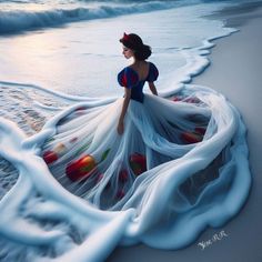 a woman is standing on the beach in a dress that has been made to look like snow white