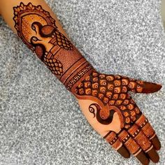 henna tattoo on the palm of someone's hand