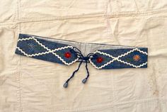 "Deadstock vintage 1940s handmade Bavarian belt in blue with multi-color embroidered flowers and white tick-tack. Perfect for layering over dresses, blouses and sweaters. Flaws: One little spot from storage on inner lining (not visible when worn).  measurements lying flat (double where necessary):  width: 15\" height: 2\" fits 28-32\" waist Please review store policies prior to purchase. All items in this shop are vintage and usually have been previously worn. Vintage is rarely perfect. I try my best to list all flaws found in the garments, however it is possible to miss a small flaw from time to time. If you see something in the photographs you're uncertain about please ask. Sales are final. Please refer to measurements for proper fit and send me a message if you have any question!" Tick Tack, Embroidered Wool, Suspender Belt, Cute Sets, Blouse Vintage, Embroidered Flowers, Suspenders, Hand Embroidered, Belts