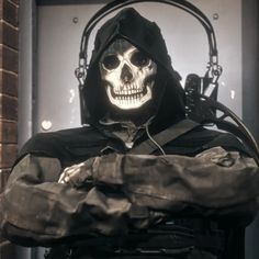 a skeleton wearing a hooded jacket and holding a knife in his hand with headphones on