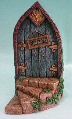 a statue of a door with the word welcome on it