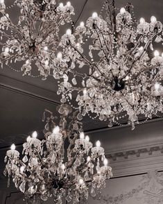 a chandelier hanging from the ceiling in a room