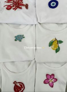 six t - shirts with embroidered designs on them