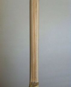 a baseball bat leaning up against a wall