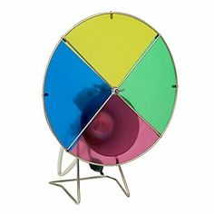 a multicolored metal object with four sections on it's sides and one section in the center