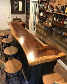 an empty bar with stools in front of it