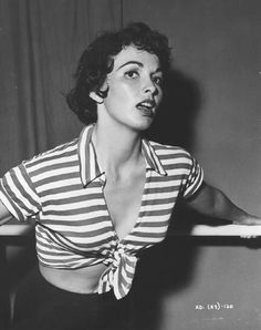 black and white photograph of a woman in striped shirt