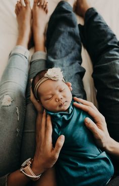 a person holding a baby in their lap