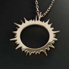 Also available with diamonds and sterling silver. Solar eclipse corona jewelry Introducing the eclipse collection to commemorate the total solar eclipse of 2024. Featuring the solar corona and the "diamond ring" effect. About this piece This pendant necklace is made of 14K solid gold and the charm is available in two sizes: 5/8" (16mm) and 7/8" (23mm). The necklace comes with a 16-18" length adjustable gold chain. Optional complementary engraving included – you will receive an email after you pl Luxury Celestial Round Necklaces, Luxury Celestial Necklace With Sun And Moon Design, Celestial Style Yellow Gold-plated Necklaces, Luxury Celestial Sun And Moon Necklace, Solar Eclipse Necklace, Solid Gold Charms, Space Jewelry, Total Solar Eclipse, The Eclipse