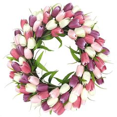 a wreath with pink and white tulips is shown on a white background,