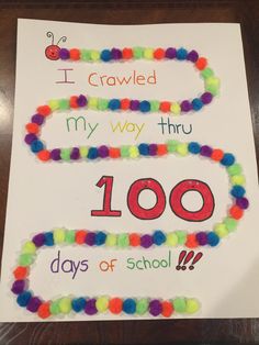 this is an image of a sign for 100th day of school with beads on it