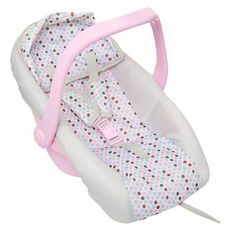 a pink and white baby car seat with polka dots