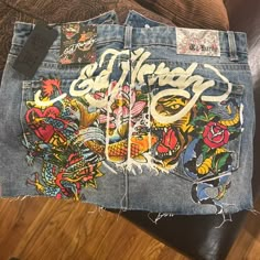 Ed Hardy Size Medium Denim Skirt. Multi-Colored Graphic Design On Back Of Skirt. Denim Skirt Recycle, Ed Hardy Skirt, Ed Hardy Designs, Teen Swag, Y2k Fits, Teen Swag Outfits, Finding My Style, School Shopping, Fits Inspo