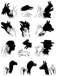 some black and white drawings of hands holding up animals, birds, and people's heads