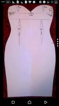 the back of a dress is cut out with scissors and thread on it's sides