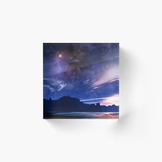 the night sky with stars and clouds over water acrylic print mounted on wall