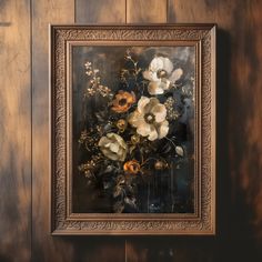 an oil painting of flowers in a gold frame on a wooden wall with dark wood paneling