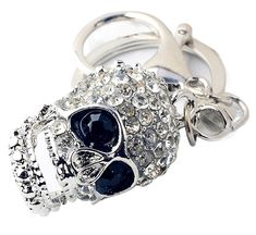 a keychain with a skull and crystal stones on it's front end