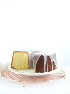 a bundt cake on a plate with one slice cut out