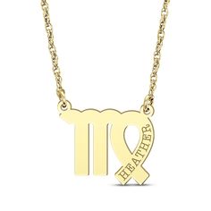 an 18k gold necklace with the zodiac sign and heart in it, on a white background