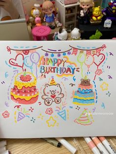 a birthday card with teddy bears on it and balloons in the background, surrounded by other toys