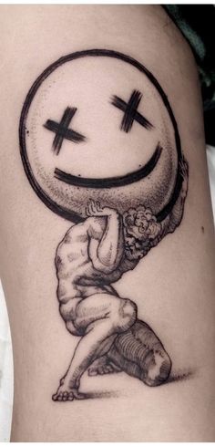 a person with a smiley face on their thigh