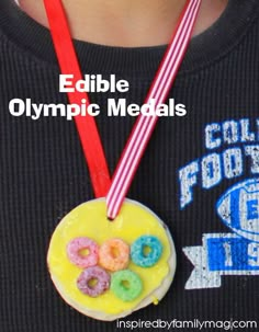 a person wearing a medal with a doughnut on it and two straws in front of them