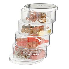 three tier acrylic storage container with beads, rings and bracelets in it