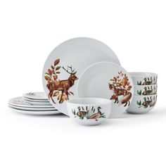 a set of dishes with deer designs on them