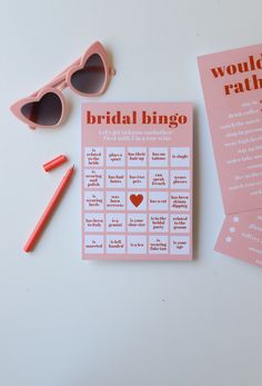 the bridal bingo game is next to sunglasses, pencils and eyeglasses