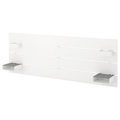 a white wall mounted shelf with two shelves