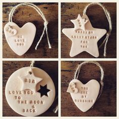 four ceramic ornaments with words and stars on them