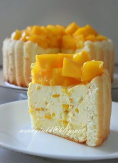 there is a piece of cake with mango on the top and one slice cut out