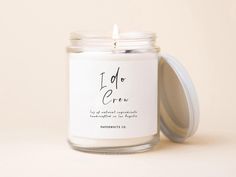 a candle with a label on it sitting in front of a white background that says, i do or grow