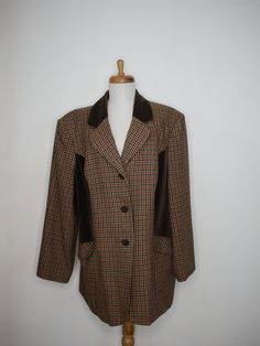 "Beautiful Women's Tan Plaid Blazer with Dark Brown Velvet Collar and Side Panels in Very Good Condition. Women's size 18. Plaid Wool is Tan with Brown, Blue and Red Plaid. Three Velvet Buttons with Two Deep Side Pockets. Lightly Padded Shoulders. Medium Weight Wool Mix with Acetate Lining and Cotton Velvet. Buttons are Slightly Worn. Dry Clean Only. By Style Exchange. Measurements: Shoulder to Shoulder: 21\" (42\" total) Sleeves: 21\" Long Bust: 48\" Tapered Waist: 46\" Hips:48\" Length: 31\"" Velvet Collar, Tan Plaid, Brown Velvet, Womens Blazers, Plaid Blazer, Cotton Velvet, Wool Plaid, Side Panels