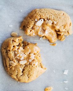 two cookies with peanut butter on top